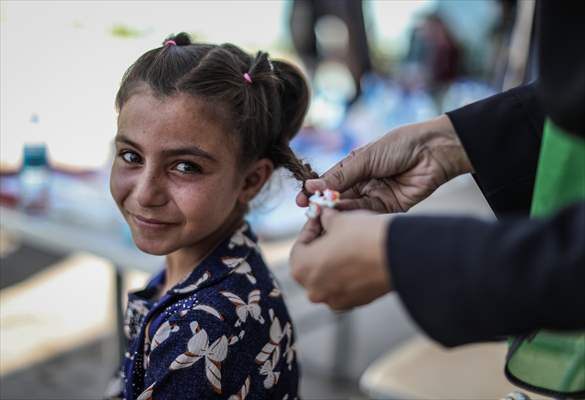 Volunteer hairdressers in Jarabulus cheer the Orphan girls