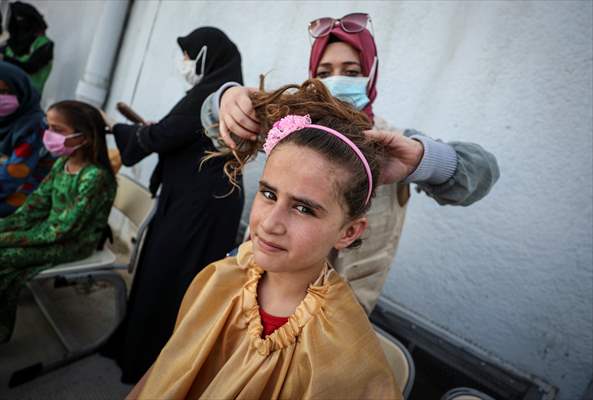Volunteer hairdressers in Jarabulus cheer the Orphan girls