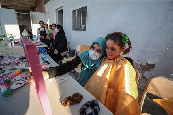 Volunteer hairdressers in Jarabulus cheer the Orphan girls