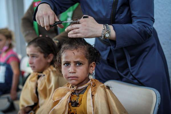 Volunteer hairdressers in Jarabulus cheer the Orphan girls