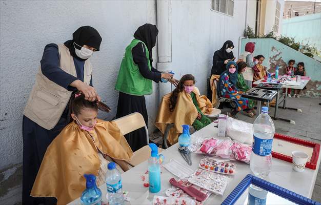 Volunteer hairdressers in Jarabulus cheer the Orphan girls