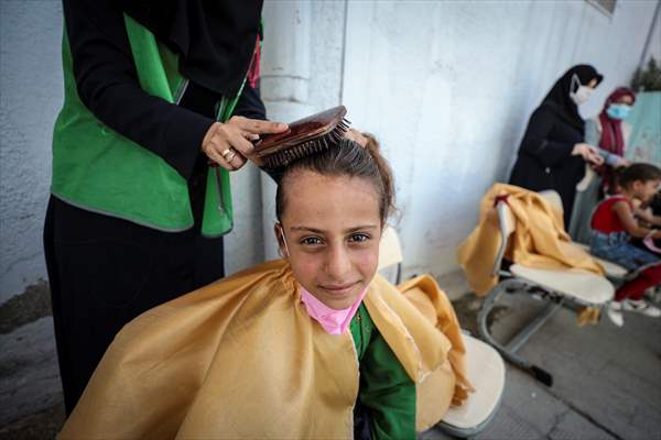 Volunteer hairdressers in Jarabulus cheer the Orphan girls