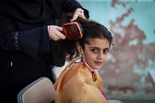 Volunteer hairdressers in Jarabulus cheer the Orphan girls